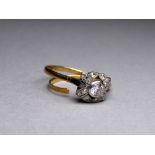 A diamond dress ring - the central stone approx. 0.4 ct, within a bow setting on a yellow metal, 4.