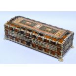 An Anglo Indian glove box - tortoiseshell and bone decorated and raised on paw feet, height 8cm,