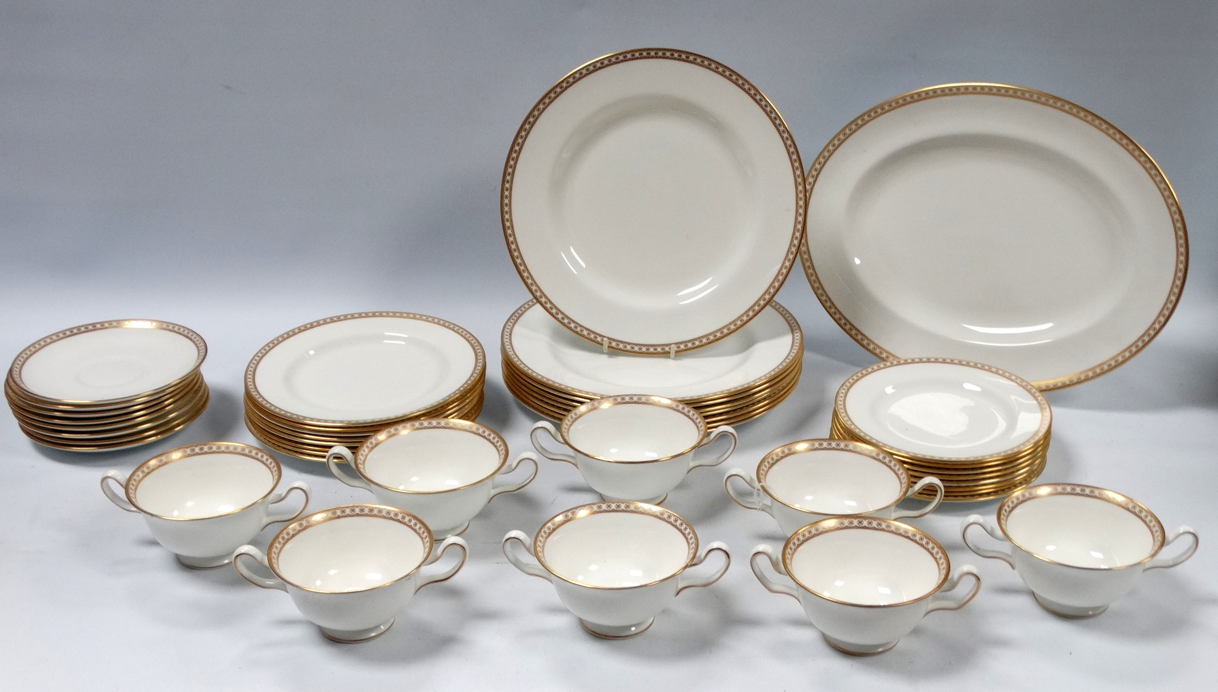 A 20th century Wedgwood dinner service - for eight place settings retailed by T. Goode & Co.,