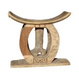 An Ashanti stool - with carved decoration and support in the form of a boot, width 50cm x depth 20cm