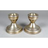 A pair of silver candlesticks - Birmingham 1921, sponsor's mark for W I Broadway & Co, height 5.