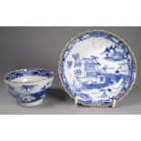 An 18th century Chinese tea bowl and saucer - blue and white landscape pattern with gilt rims, tea