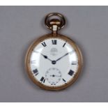 A Waltham open face pocket watch in a 9ct gold case - the white enamel dial set out in Roman
