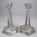 A pair of French Art Deco style candlesticks - clear glass of tapering hexagonal form, height 19cm.