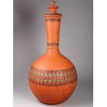 Christopher Dresser for Watcombe Pottery - a bottle vase and cover with a band of strapwork