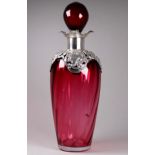 A silver mounted cranberry glass decanter - Birmingham 1899, sponsor's mark for Mitchell Bosley &