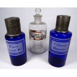 Two late 19th century blue glass apothecary bottles - with etched contents labels and pewter covers,