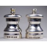 A pair of silver baluster shaped salt and pepper grinders - London 2012, height 7cm.