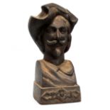 A cast iron bust of a cavalier - with moustache and Van Dyke beard, raised on a square base,