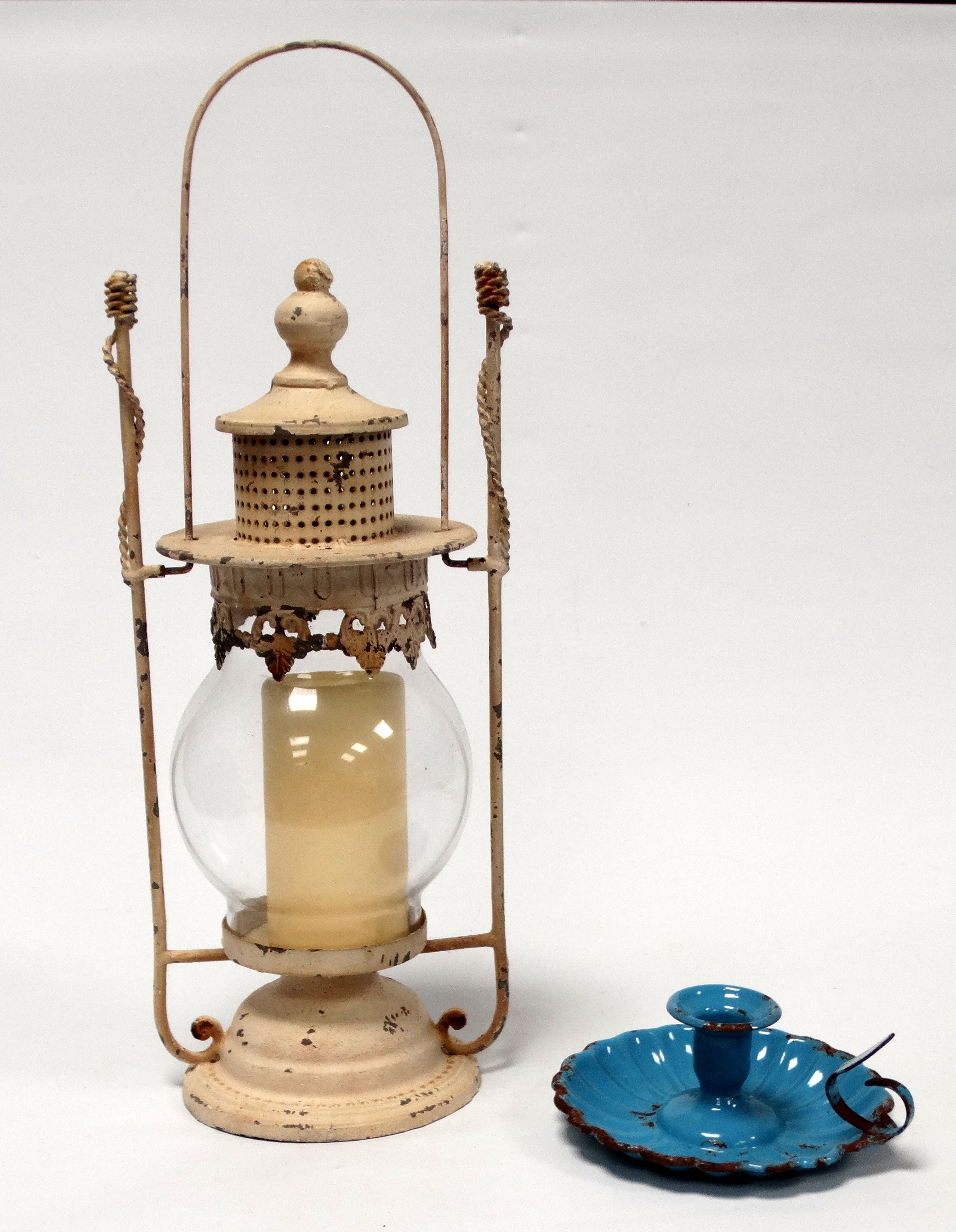 A white painted candle lantern - height 51cm, together with a blue enamel chamberstick.