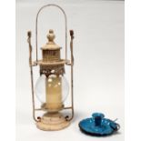 A white painted candle lantern - height 51cm, together with a blue enamel chamberstick.