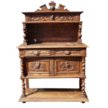 A 17th century style continental carved oak buffet - the raised back with shelf and lion supports