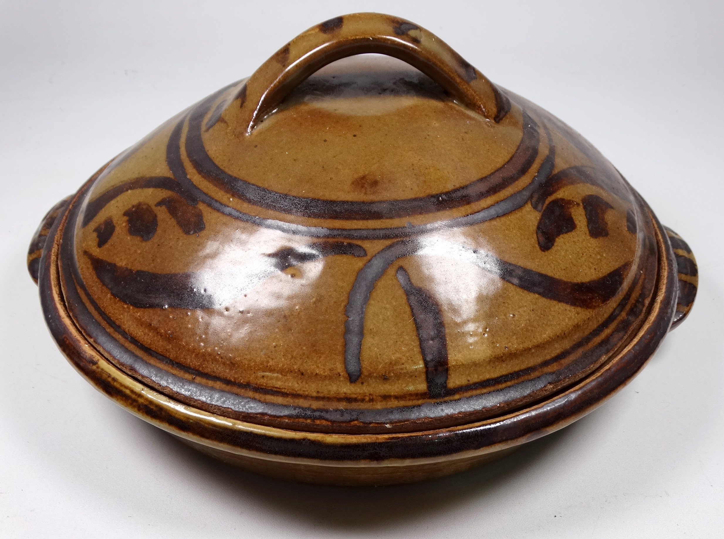 A Seth Cardew casserole dish and cover - impressed with Seth Cardew and Bridge Pottery marks,