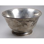 A white metal bowl - the ball mounted lip raised on a foot, possibly French, with purity stamps to