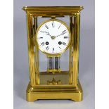 A four glass mantel clock - modelled in the form of a carriage clock, the corniche case fitted