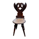 A late 19th century folk art chair - possibly Norwegian, the pierced back carved with entwined