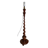 A 19th century walnut torchiere - by Gillham of Canterbury, the tapering spiral column on a circular