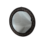 An Arts and Crafts style Hugh Wallis circular convex wall mirror - the copper frame with silvered