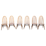 A set of six Ercol dining chairs - with stick backs and solid contoured seats on turned legs