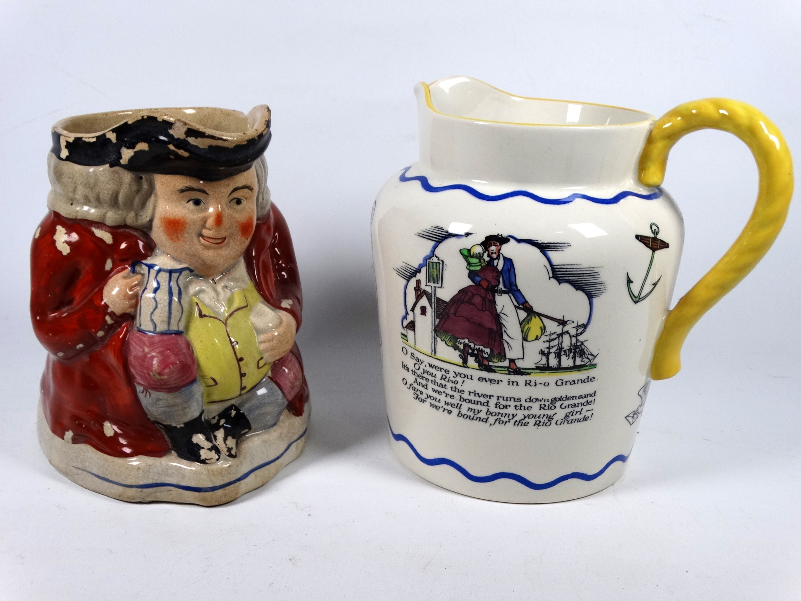 A 19th century Staffordshire Toby jug - height 16cm, together with a Royal Doulton Sea Shanty jug (