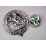 A Scottish clan brooch - together with a silver lapel badge with enamel clover leaf decoration.