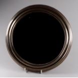 A 20th century white metal framed circular mirror - of moulded form, with a bevelled plate, diameter