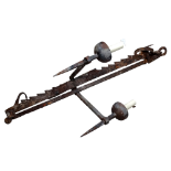 A 19th century wrought iron spit jack - now converted into a light fitting, height 95cm.