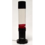 A Mathmos lava lamp - red 'lava' with black fittings, height 40cm.