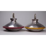 An unusual contemporary pair of silver pepper and salt grinders - London 1996, of saucer form,