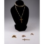 A 9ct yellow gold cross - foliate engraved on a fine chain, together with two further fine chains,