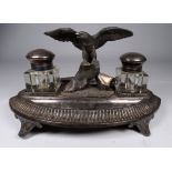 A late 19th century Britannia metal standish - of navette form and mounted with an eagle with