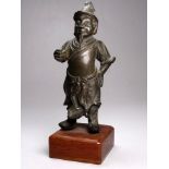 After the antique, a bronze figure of a Chinese official - mounted on a teak base, height 18cm.