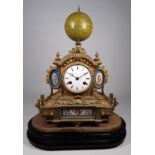 A 19th century ormolu and Sevres mounted mantel clock - surmounted by a rotating globe, the white