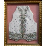 A Georgian cream silk embroidered waistcoat - extensively decorated with flowers, length 49cm,