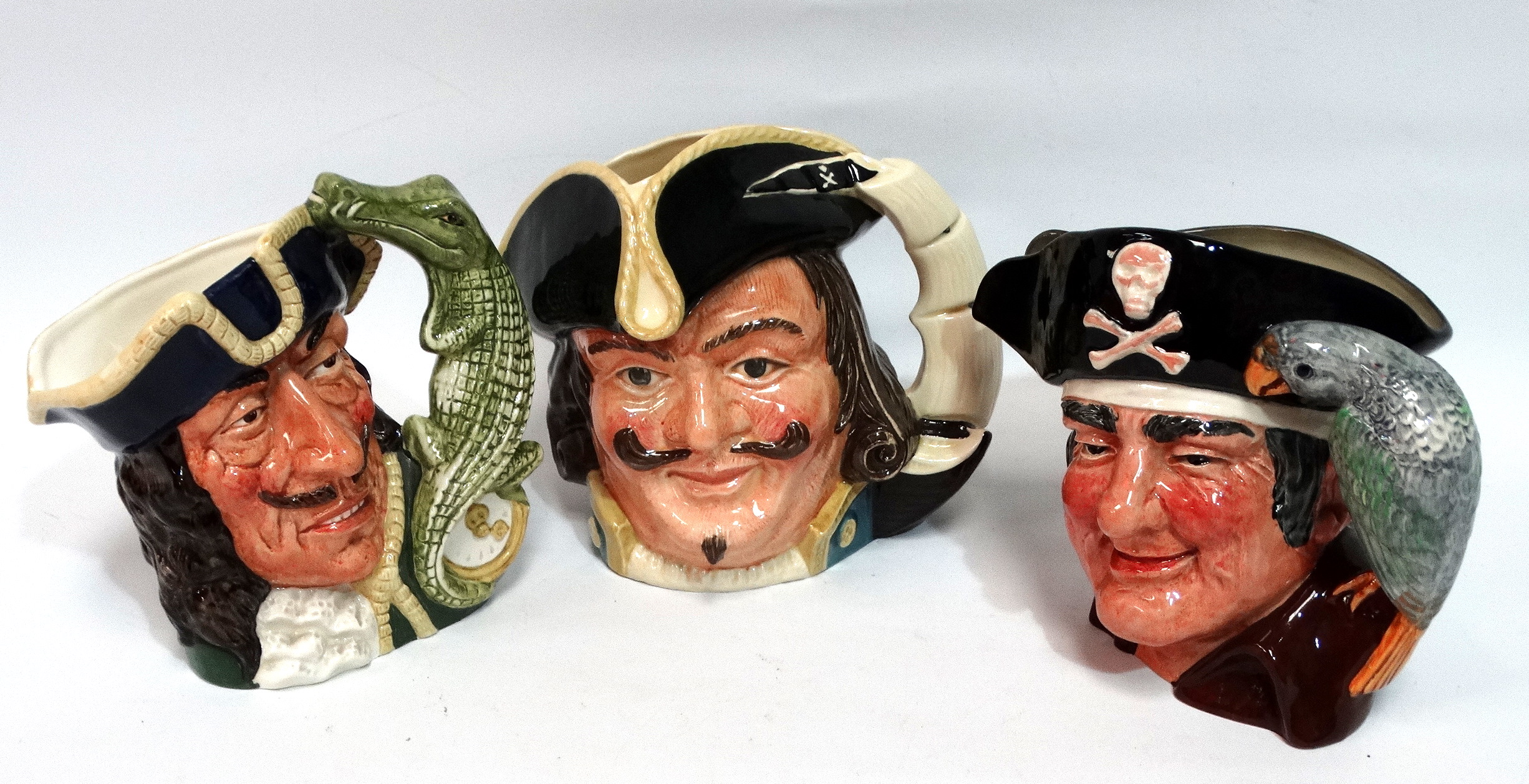 A large Royal Doulton character jug - Captain Morgan, height 18cm, together with Long John Silver