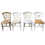 A set of four early 20th century painted side chairs - the bowed top rail and turned spindles