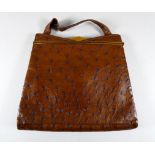 A mid 20th century ostrich leather hand bag - with a gilt metal frame and clasp, the interior moir