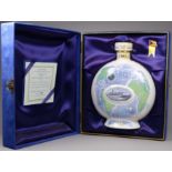 A limited edition P & O Cruises bottle of cognac - the ceramic decanter with images of shipping