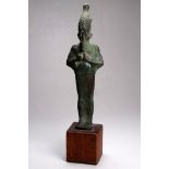 A bronze figure of Osiris - on a wooden base, height 23cm.