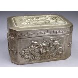 A Chinese white metal box - decorated with a dragon and cloud scrolls, a phoenix, flowers and a bird