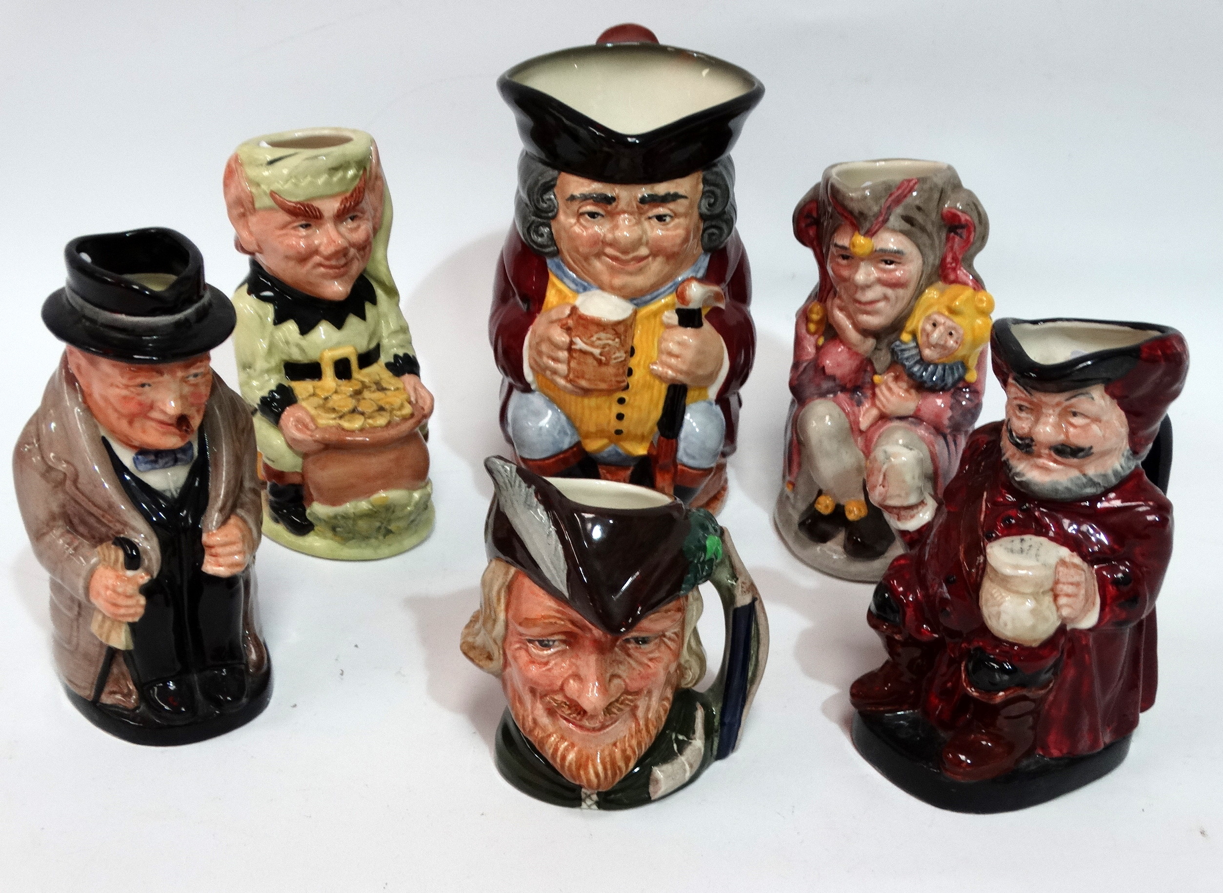 A Royal Doulton small character jug - Winston Churchill, height 14cm, together with Jolly Toby,