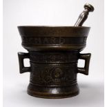 After the antique, a bronze pestle and mortar - with 17th century inscription and twin handles,