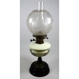 A late Victorian oil lamp - with etched clear glass globe and cream reservoir painted with