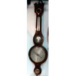 A 19th century mahogany cased barometer - incorporating a thermometer, a mirror and a level,