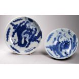 An early 20th Chinese blue and white rice bowl - decorated with a dragon chasing a pearl, diameter