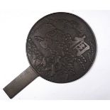 An early 20th century Chinese bronze mirror - the reverse decorated with a landscape scene and