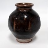 A Leach Pottery tenmoku glazed pot - of globe faceted form, indistinct impressed marks to foot