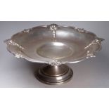 A silver comport - Sheffield 1934, Walker and Hall, the shaped rim incorporating foliate pendants,