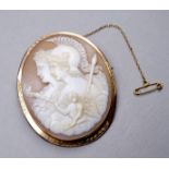 A finely carved cameo brooch - depicting two female figures, one wearing a helmet, set within a