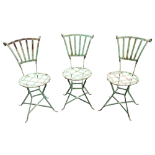 A set of three early 20th century Parisian cafe chairs - green painted wrought steel with a fan